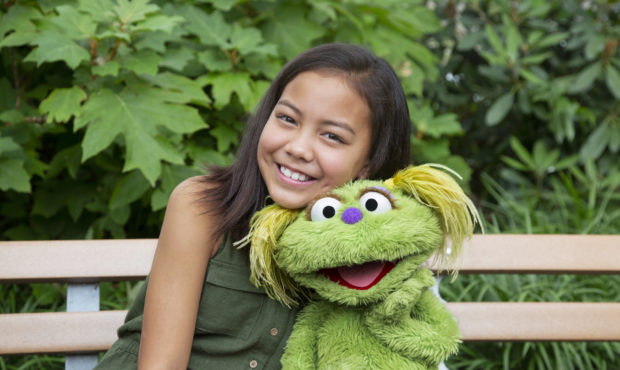 This undated image released by Sesame Workshop shows 10-year-old Salia Woodbury, whose parents are ...