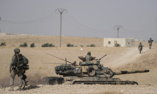 Turkish tanks and troops stationed near Syrian town of Manbij, Syria, Tuesday. Oct. 15, 2019. Russi...