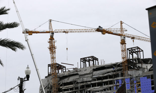 Two unstable cranes loom over the construction of a Hard Rock Hotel, Thursday, Oct. 17, 2019, in Ne...