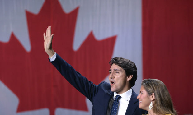 Liberal leader Justin Trudeau and wife Sophie Gregoire Trudeau wave as they go on stage at Liberal ...