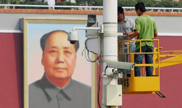 BEIJING - SEPTEMBER 06:  Chinese labourers adjust a surveillance camera at Tiananmen Square ahead o...