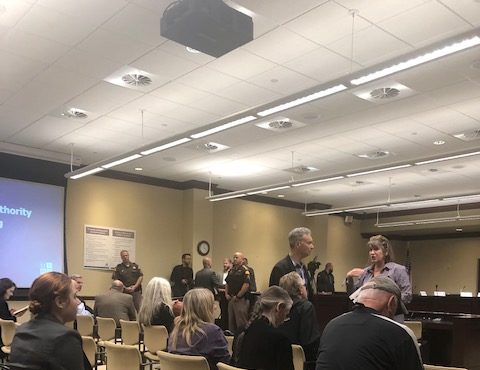 People wait to voice their concerns during the Utah Inland Port Authority meeting at the State Capi...