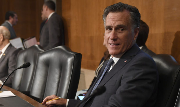 Sen. Mitt Romney, R-Utah, talks with a colleague during a break in an executive session of the Sena...