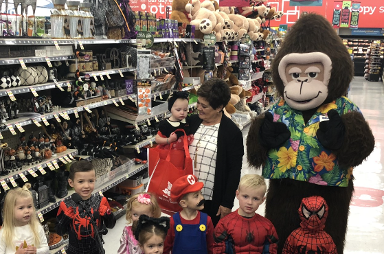 First lady Jeanette Herbert poses with a few spooky kids at Macey's in Salt Lake City. Herbert, alo...