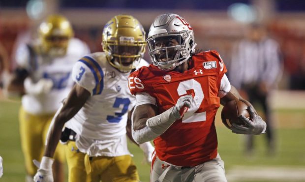 Utah running back Zack Moss (2) leaves UCLA defensive back Rayshad Williams (3) behind on his way t...