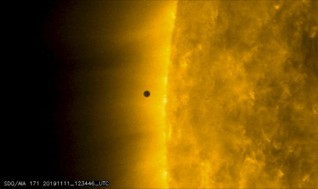 This still image from video issued by NASA's Solar Dynamics Observatory shows Mercury as it passes ...