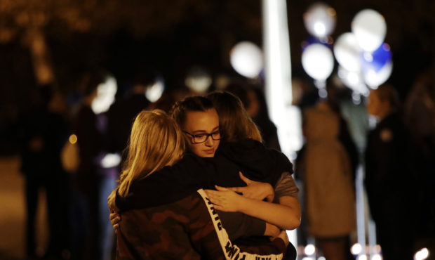 Students embrace during a vigil at Central Park in the aftermath of a shooting at Saugus High Schoo...