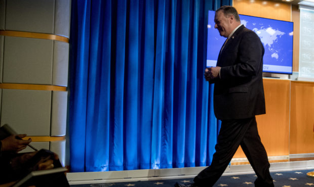 Secretary of State Mike Pompeo, leaves a news conference at the State Department in Washington, Mon...