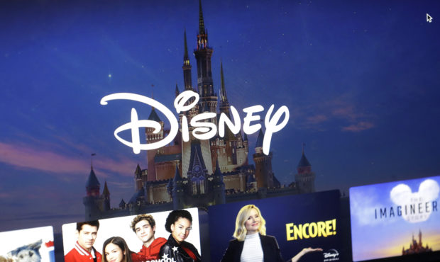 FILE - Wednesday, Nov. 13, 2019 file photo, a Disney logo forms part of a menu for the Disney Plus ...