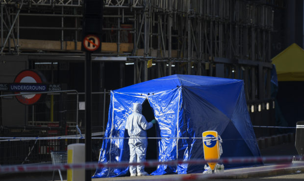 Forensic officers attend the scene in central London, Saturday, Nov. 30, 2019, after an attack on L...