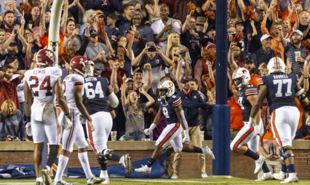 Auburn running back Shaun Shivers (8) celebrates his touchdown run late in the second half of an NC...