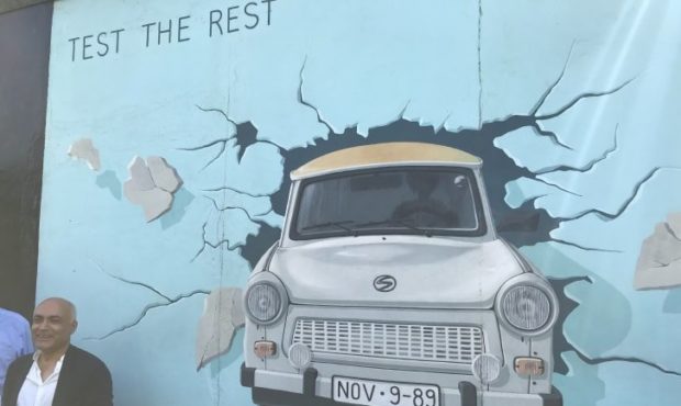 Alavi helped convince an East German artist to paint a now-famous image of her car driving through ...