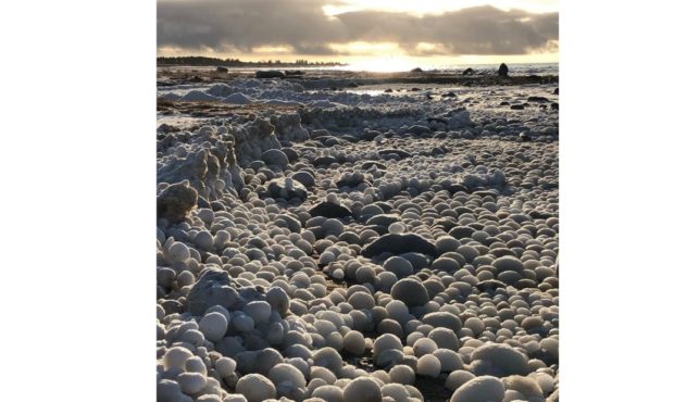 (CNN) Balls of ice accumulate and form on a Finland beach....