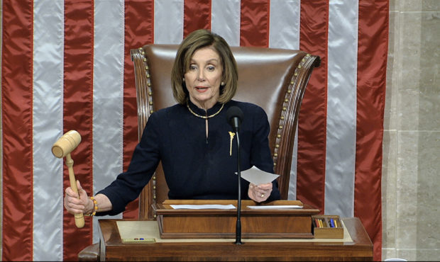 House Speaker Nancy Pelosi of Calif., announces the passage of the first article of impeachment, ab...