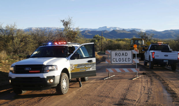 This Saturday, Nov. 30, 2019, photo shows the road closed near Bar X road and Tonto Creek after a v...
