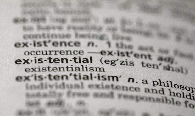 This Sunday, Dec. 1, 2019, photo shows the word "existential" in a dictionary in the Brooklyn borou...