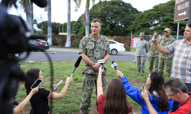U.S. Navy Rear Adm. Robb Chadwick speaks to the media at the main gate at Joint Base Pearl Harbor-H...