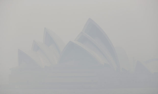 Thick smoke from wildfires shroud the Opera House in Sydney, Australia, Tuesday, Dec. 10, 2019. Hot...
