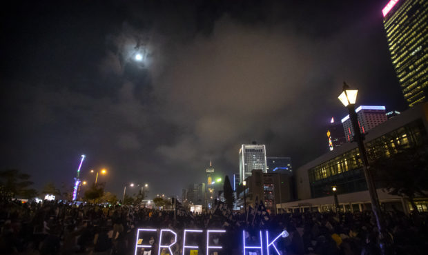 Protesters hold a sign "Free HK" at a rally in Hong Kong, Thursday, Dec. 12, 2019. Protesters in Ho...