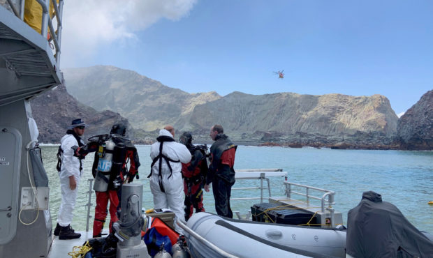 Police divers prepare to search the waters near White Island off the coast of Whakatane, New Zealan...
