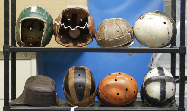 FILE - In this Sept. 23, 2010, file photo, various football helmets, used for testing helmet-to-hel...