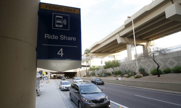 Vehicles wait for their passengers at the Ride Share pickup point at Phoenix Sky Harbor Internation...
