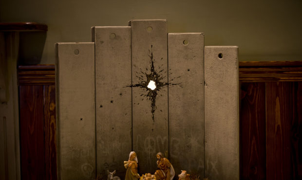 A new artwork dubbed "Scar of Bethlehem" by the artist Banksy is displayed in The Walled Off Hotel,...