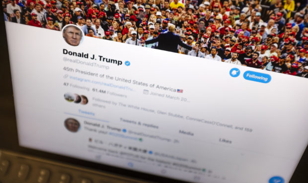 FILE - This June 27, 2019, file photo President Donald Trump's Twitter feed is photographed on an A...
