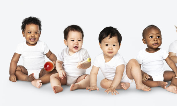 Diverse babies sitting on the floor. Photo courtesy Getty Images...