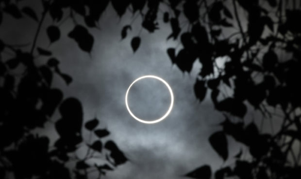 TOPSHOT - The moon totally covers the sun in a rare "ring of fire" solar eclipse as seen from the s...