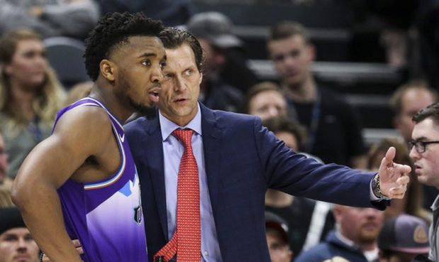 Jazz head coach Quin Snyder talks to guard Donovan Mitchell (45) during a break in play in the seco...