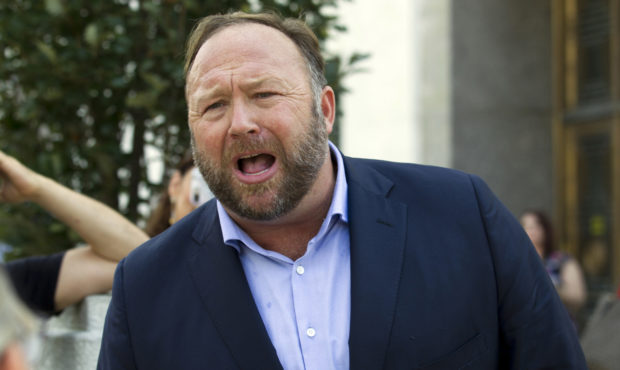 FILE- In this Sept. 5, 2018, file photo conspiracy theorist Alex Jones speaks outside of the Dirkse...