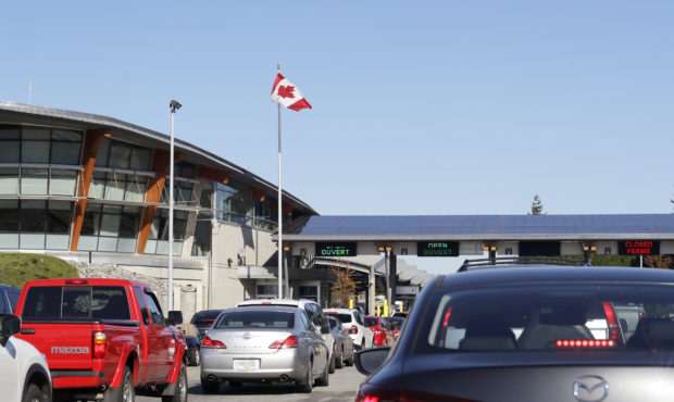 Oct. 9, 2019 file photo, traffic enters Canada from the United States at the Peace Arch Border Cros...