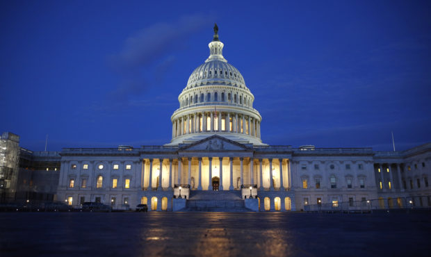 FILE - In this Dec. 4, 2019, file photo, light shines on the U.S. Capitol dome in Washington. (AP P...