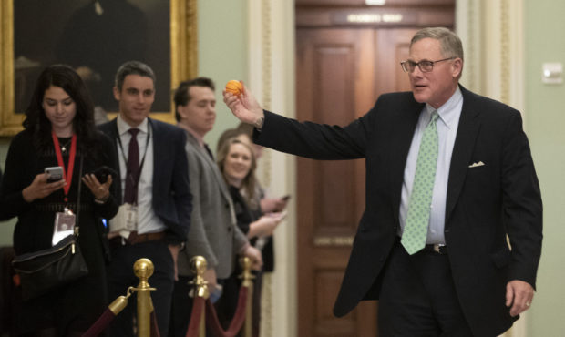 Sen. Richard Burr R-NC., displays a stress ball as he walks to the Senate Chamber prior to the star...