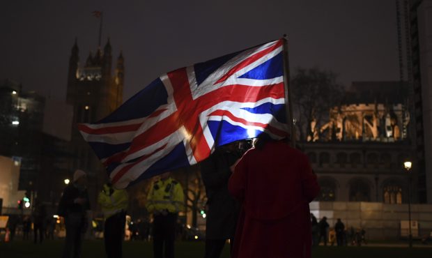 Brexit supporters gather during a rally at the Parliament square in London, Friday, Jan. 31, 2020. ...