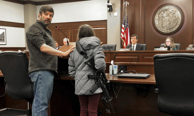 Charles Nielsen, 58, and his 11-year-old granddaughter, Bailey Nielsen, testify before a House pane...