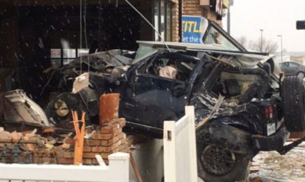Car crashes into Layton business...