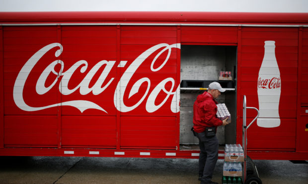 A delivery truck driver unloads Coca-Cola Co. soft drinks in Lawrenceburg, Kentucky, U.S., on Monda...