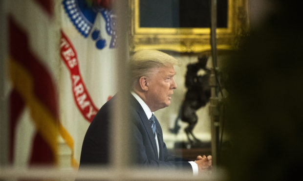 President Donald Trump addresses the nation from the Oval Office at the White House, Wednesday, Mar...