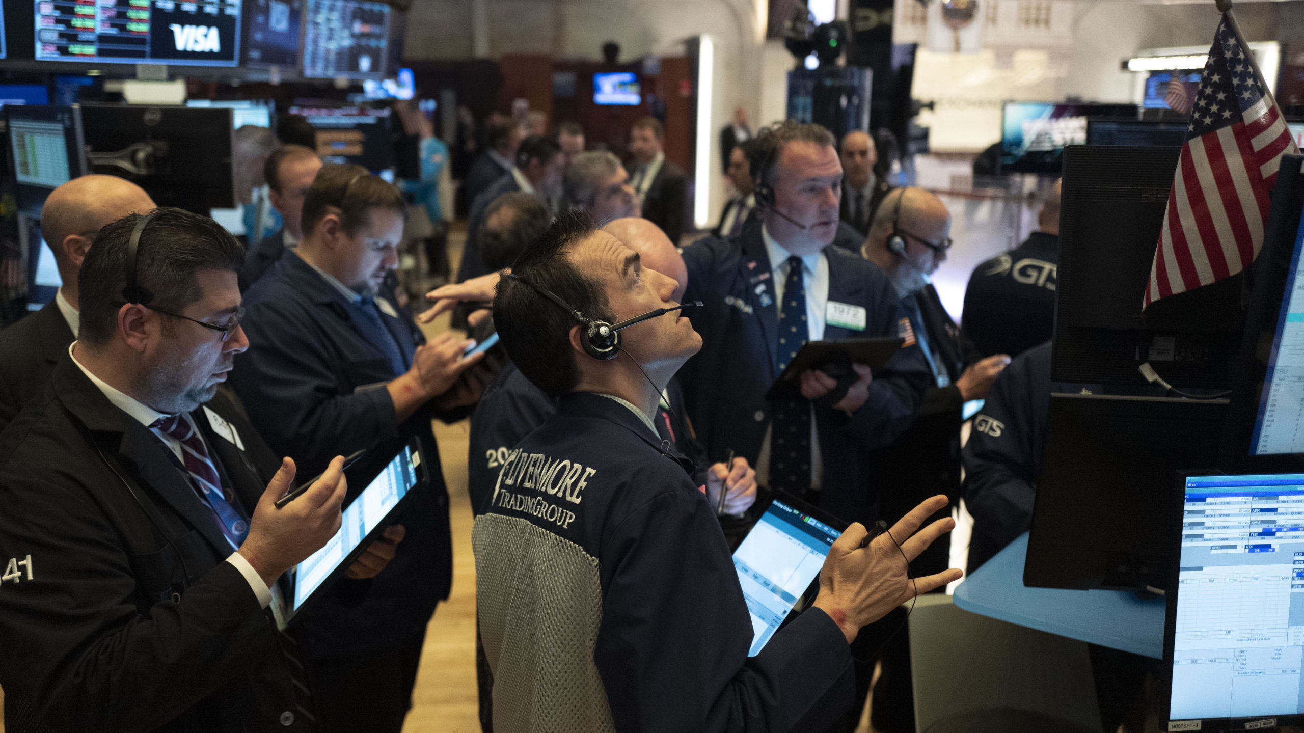 Traders work at the New York Stock Exchange, Wednesday, March 18, 2020 in New York. Global stock ma...