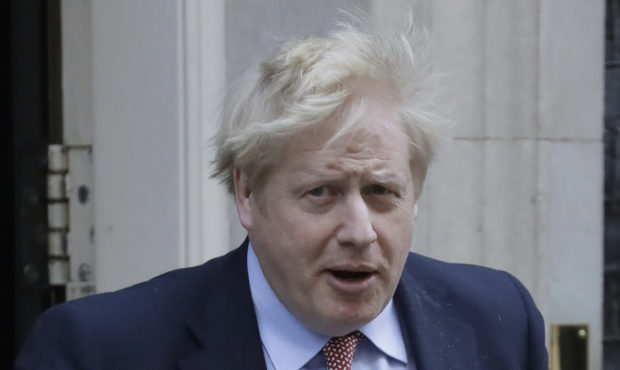 FILE - In this Wednesday, March 25, 2020 file photo Britain's Prime Minister Boris Johnson leaves 1...