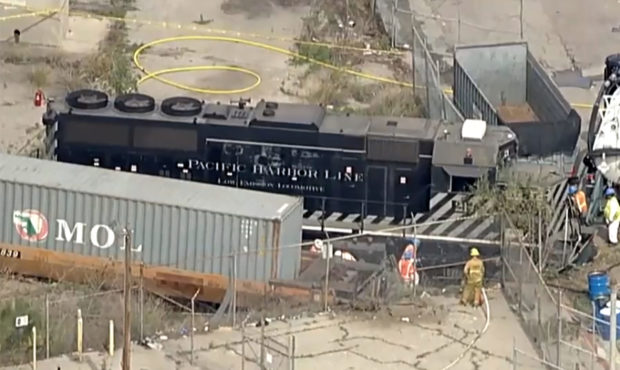 This aerial image taken from video provided by KABC-TV shows a Pacific Harbor Line train that derai...