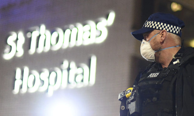 A police officer stands outside St Thomas' Hospital in central London as British Prime Minister Bor...