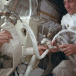 In this April 1970 photo provided by NASA, Apollo 13 command module pilot John Swigert helps to hook up a lithium hydroxide canister in the lunar module, in an effort to get rid of carbon dioxide in the cabin as the spacecraft attempts to return to Earth. The explosion of an oxygen tank in the service module forced the three-man crew to rely on the lunar module as a "lifeboat." (NASA via AP)