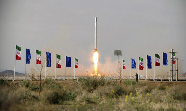 In this photo released Wednesday, April 22, 2020, by Sepahnews, an Iranian rocket carrying a satell...