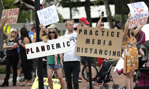 FILE - In this April 17, 2020, file photo, protesters demanding Florida businesses and government r...