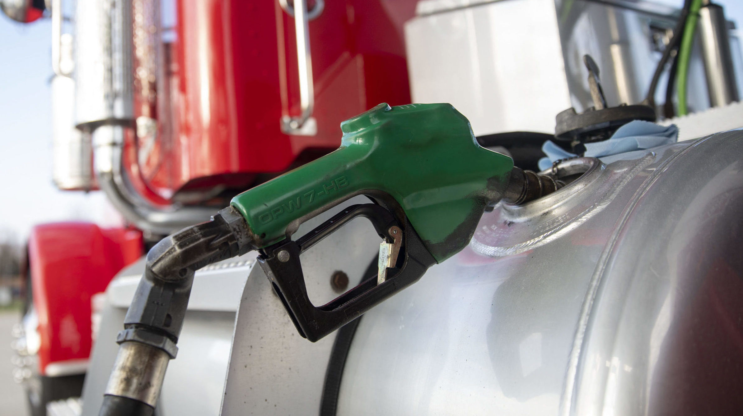 (File photo: A filler nozzle pumps fuel into the gas tank of a tractor trailer at a Phillips 66 gas...