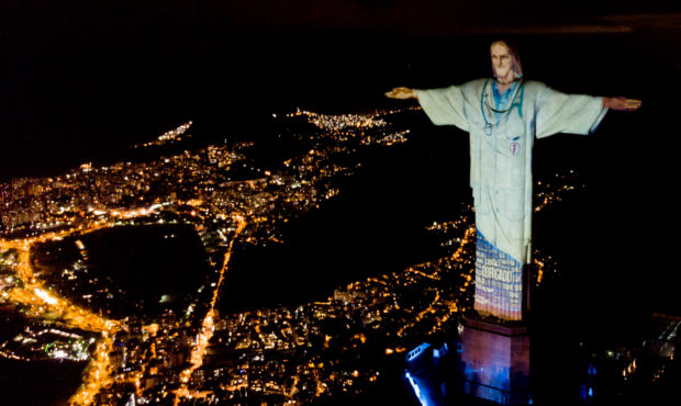 RIO DE JANEIRO, BRAZIL - APRIL 12: Aerial view of the illuminated statue of Christ the Redeemer tha...