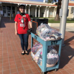 Deirdre Smith, program manager at Santa Barbara County Jail and former convict, collects mask to be sewn.